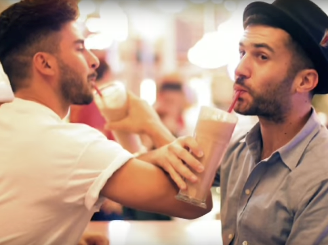 Duck Sauce linking arms and drinking milkshakes