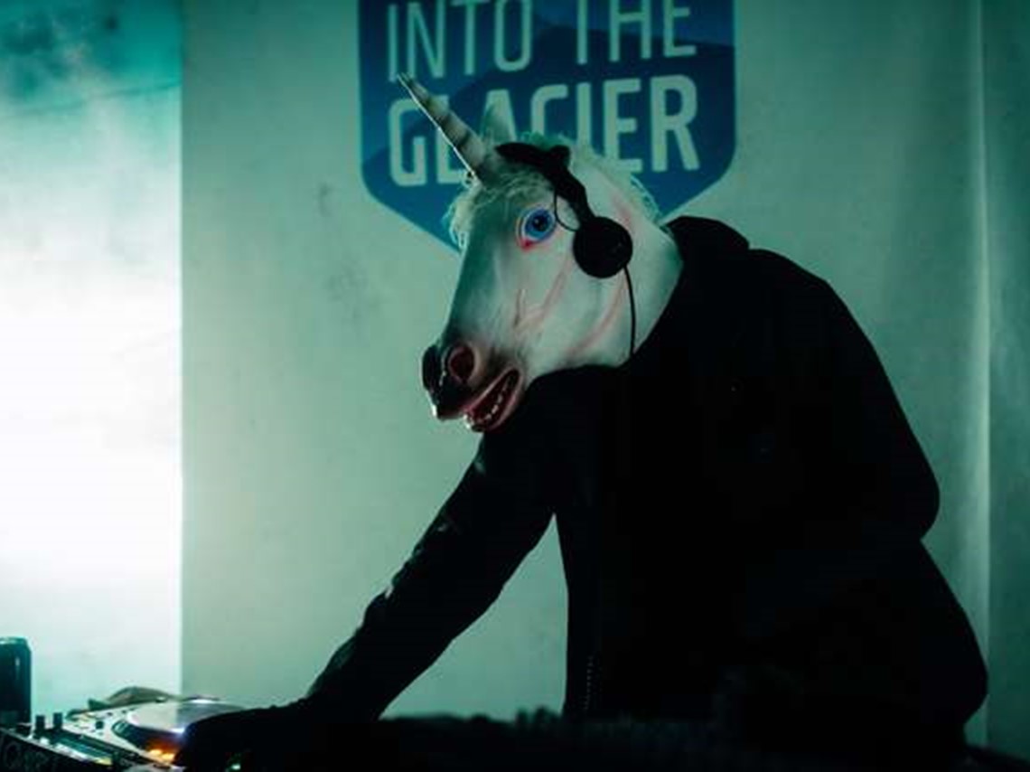 Artwork DJ'ing with unicorn mask