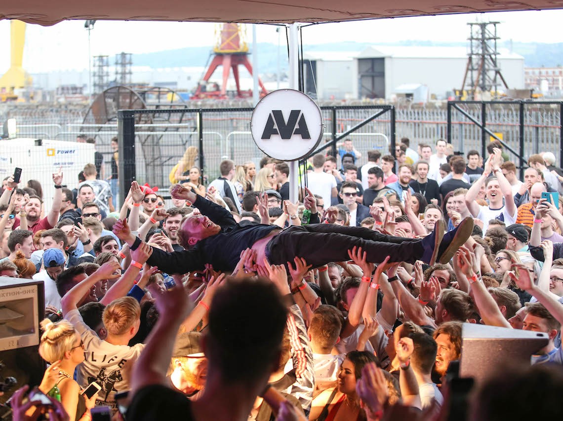 DJ Phil Kieran crowdsurfing at Belfast's AVA Festival